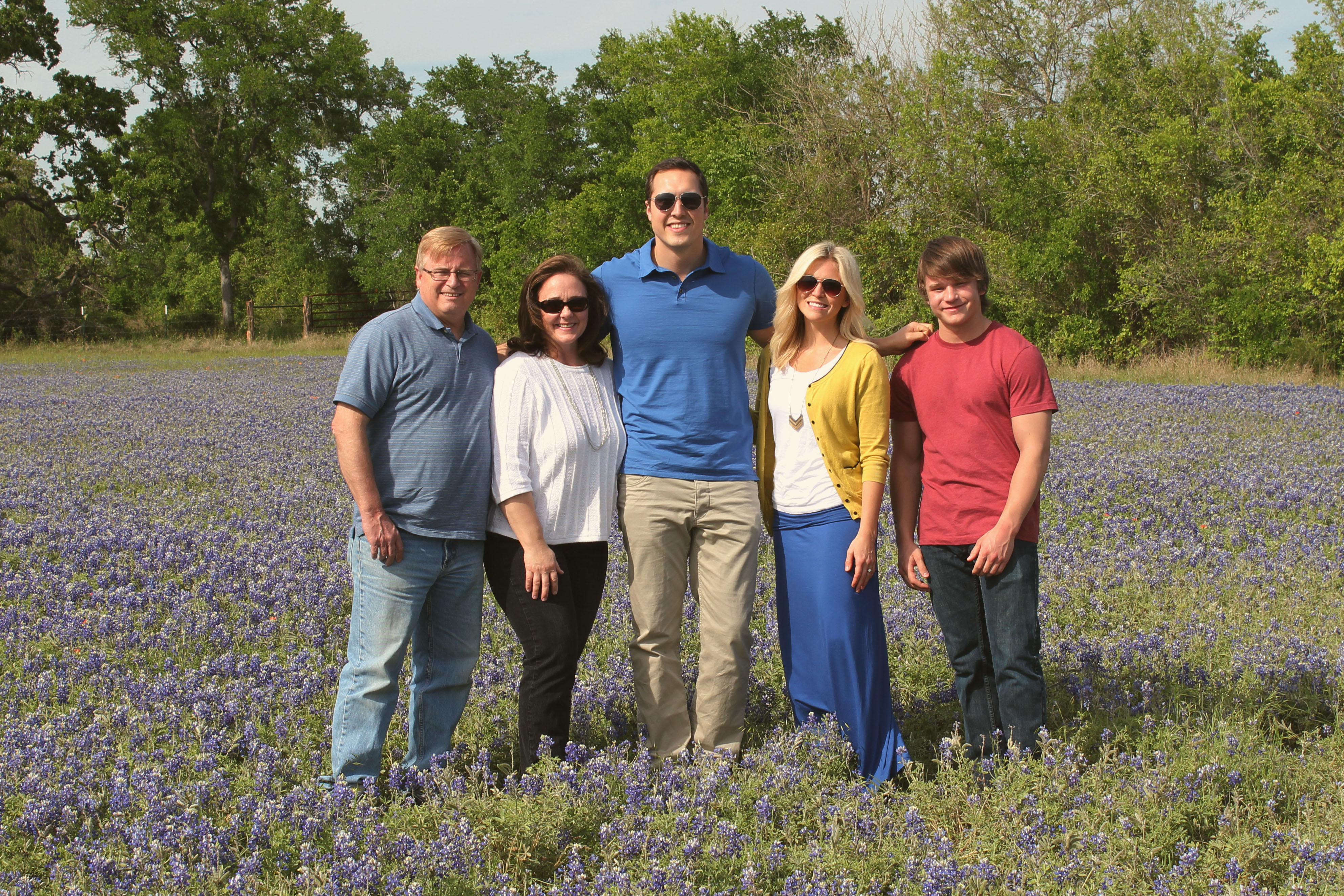 family and bluebonnets